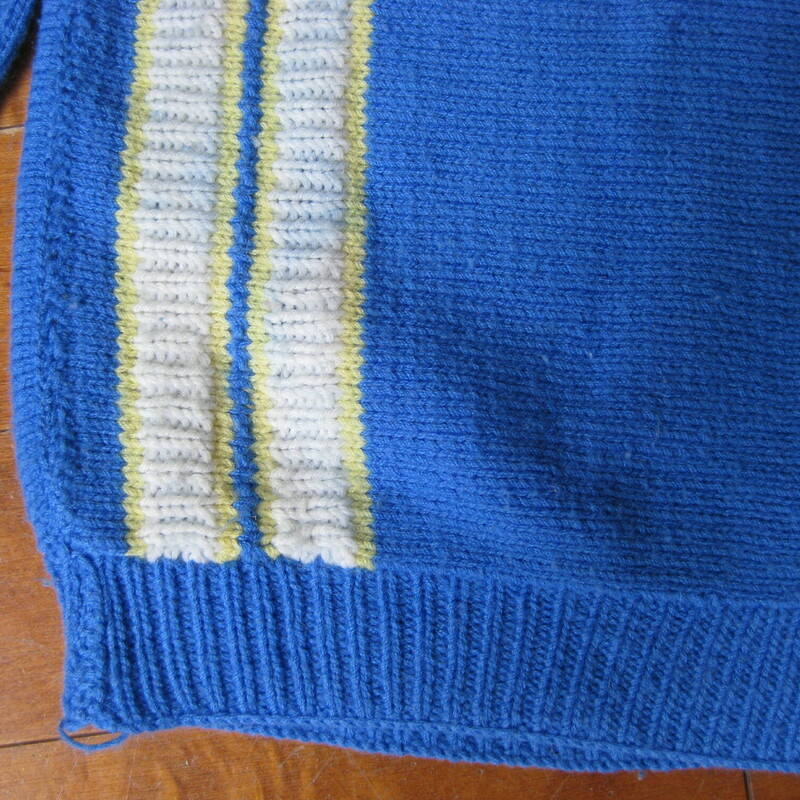 THis is a little boys' sweater and cap set from the 1960s.<br />
It belonged to a friend of mine and was given to me by his mother as she is doing some clearing out.<br />
Very sweet blue color with white and yellow stripes<br />
<br />
No labels, feels like wool acrylic blend<br />
<br />
I couldn't find any modern boys sizing charts to help give this a size... they all want to know how tall your boy is and what age...<br />
This will fit a child who measures 24in around at the chest<br />
The sweater is 17.5in in length<br />
Excellent condition with a tiny smidge of paint at the end of the right sleeve.<br />
<br />
thanks for looking!<br />
#16078