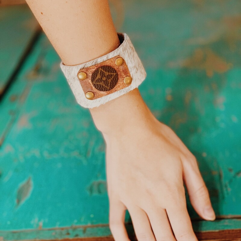 This adorable upcycled, handmade bracelet was made from an authentic Louis Vuitton bag. The bag's date code is SP0927. Made from real cowhide!

Resurrect Antiques is not affiliated with the LV company.