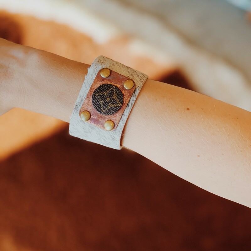 This adorable upcycled, handmade bracelet was made from an authentic Louis Vuitton bag. The bag's date code is SP0927. Made from real cowhide!<br />
<br />
Resurrect Antiques is not affiliated with the LV company.