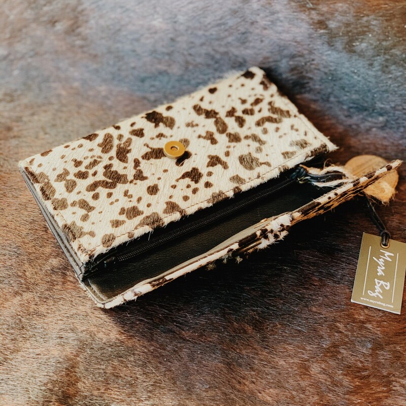 These Myra brand cowhide wallets measure 7.5 inches by 4 inches with a zippered coin compartment, a cash compartment, and six card slots!