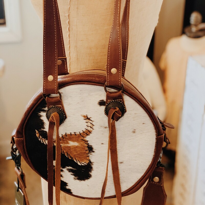 These adorable Myra circle cowhide purses have a diameter of 10 inches! Please keep in mind that no two cowhide products are exactly alike, and color patterns will differ slightly from purse to purse.