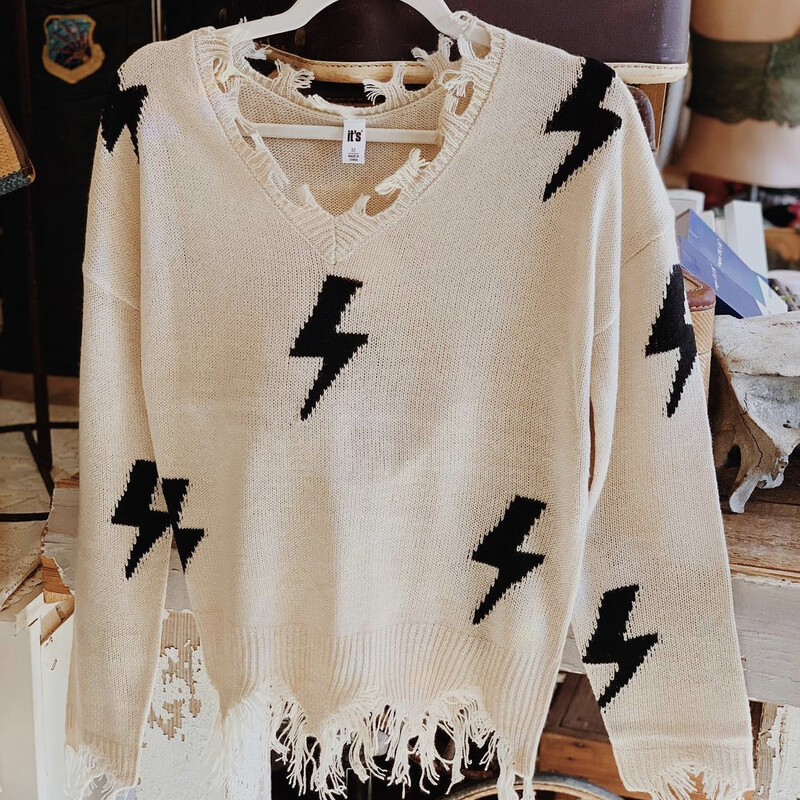 This adorable sweater with black lightning bolts on it makes getting ready so easy! Throw it on, and you're already put together!