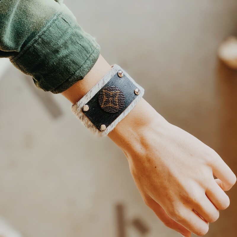 This upcycled, hand-made bracelet was made from an authentic Louis Vuitton bag! The bag's date code is SP0927.

Not affiliated with the LV company.