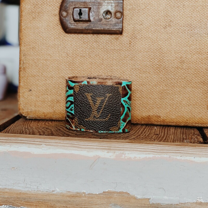 This upcycled, hand-made bracelet was made from an authentic Louis Vuitton bag! The bag's date code is SP0927.

Not affiliated with the LV company.