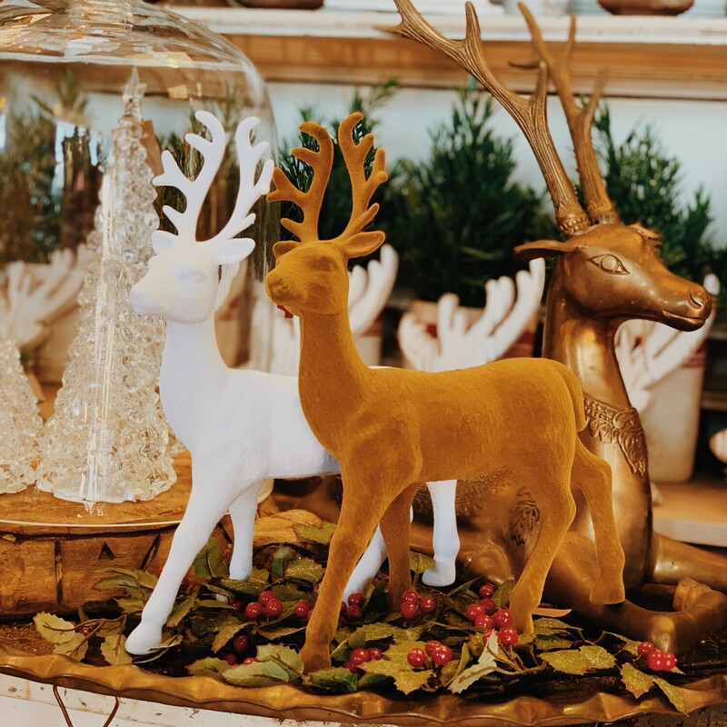 These beautiful reindeer measure 13 inches from their hooves to the top of their antlers! They are the perfect touch to your Christmas decor! They are available in a white color or a camel color.