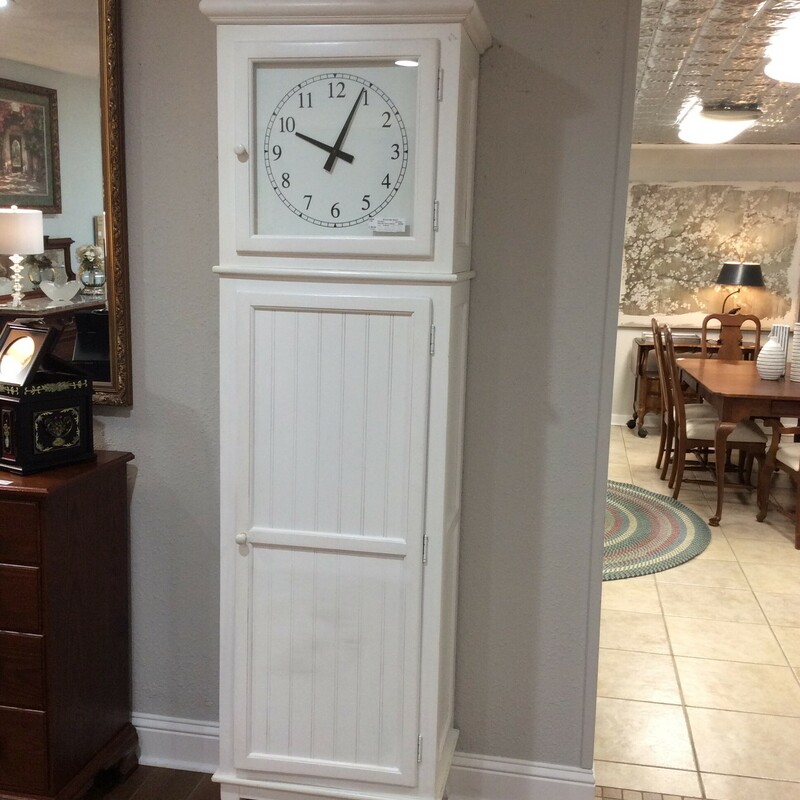 This floor clock does double duty as a wine cabinet as well. It includes a pull-out tray, drawer and cabinet space.