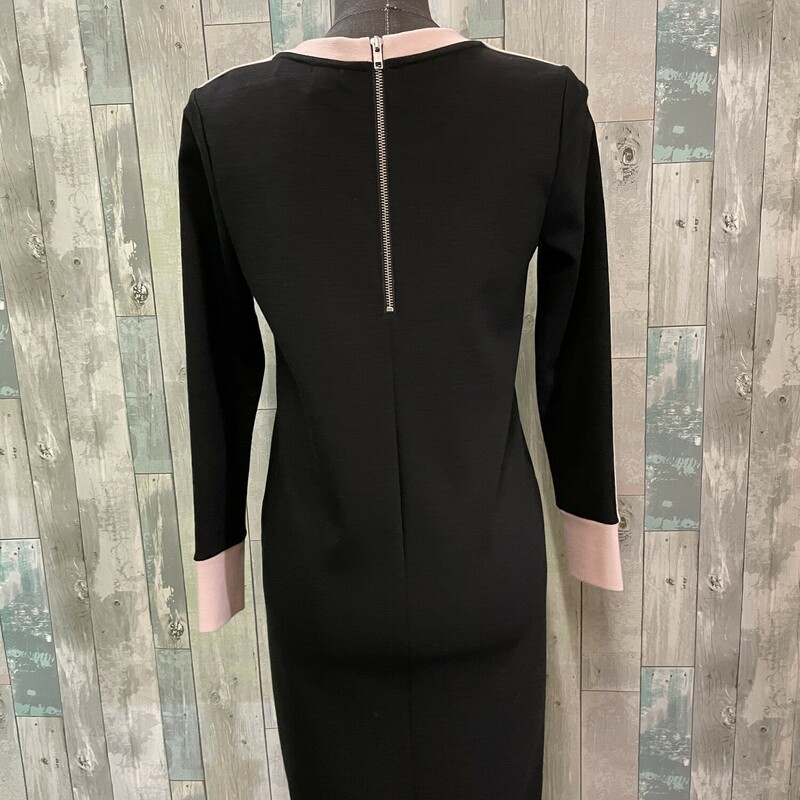 J Crew Knit Dress<br />
Back zip closure, heavy knit<br />
Body: 44% wool, 44% acrylic, 10% nylon, 2% spandex.<br />
Trim: 84% wool, 16% nylon<br />
Dry Clean<br />
Black and pink<br />
Size: Small