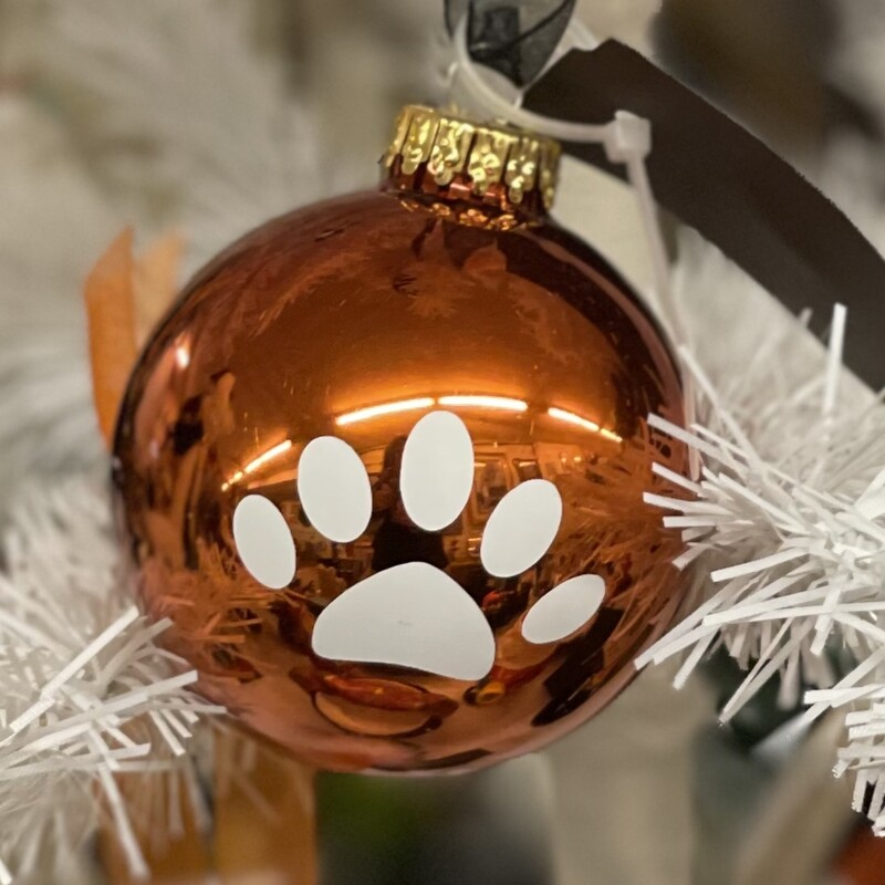 PHS Christmas Ornament<br />
PHS in white on one side and the Panther paw on the other!<br />
Orange<br />
Size: Standard