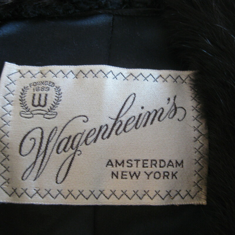 Vtg Wagenheim Pers. Lamb, Black, Size: Large<br />
This is a short faux persian lamb jacket with a fur collar.<br />
The body is black and the collar is a dark brown genuine mink<br />
Fully lined in satin, with the former owners initial embroidered inside.<br />
Purchased at a venerated fur salon in Amsterdam NY in the 1950s or 60s<br />
flat measurements taken on the inside:<br />
armpit to armpit 24<br />
Length: 24.75<br />
<br />
Thanks for looking!<br />
#42342