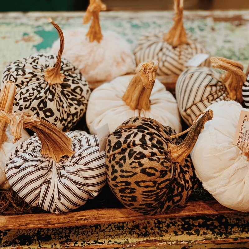 These handmade pumpkins are made from vintage fabrics and have stems from real pumpkins! They measure about 5 inches in diameter. These are one of a kind and handmade, so you'll only find them here at Resurrect! They are available in Chenille, Blue & White Chenille, Pink Chenille, Black Striped, Linen, Leopard Print 1, Leopard Print 2, Blue Ticking, and Black Ticking.