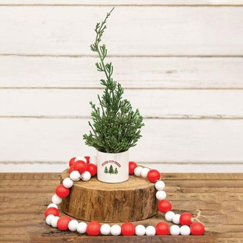 Red and white wooden bead garland  with jute loops for hanging.  These festive beads can be draped over books, placed between candles or on your tree.
Bead garland is 39 inches in length