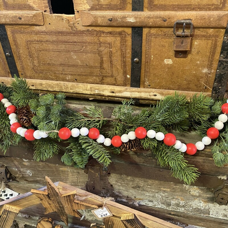 Red and white wooden bead garland  with jute loops for hanging.  These festive beads can be draped over books, placed between candles or on your tree.
Bead garland is 39 inches in length
