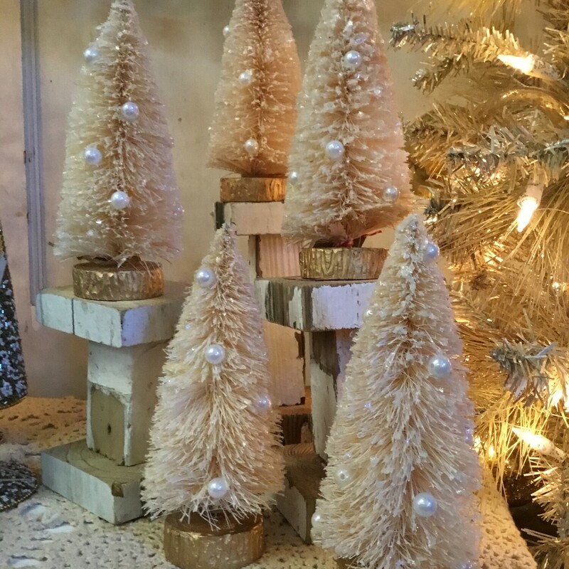 Cream colored bottle brush tree has a touch of sparkle and the pearl beads add a touch of fancy. Tree measures 7 inches tall