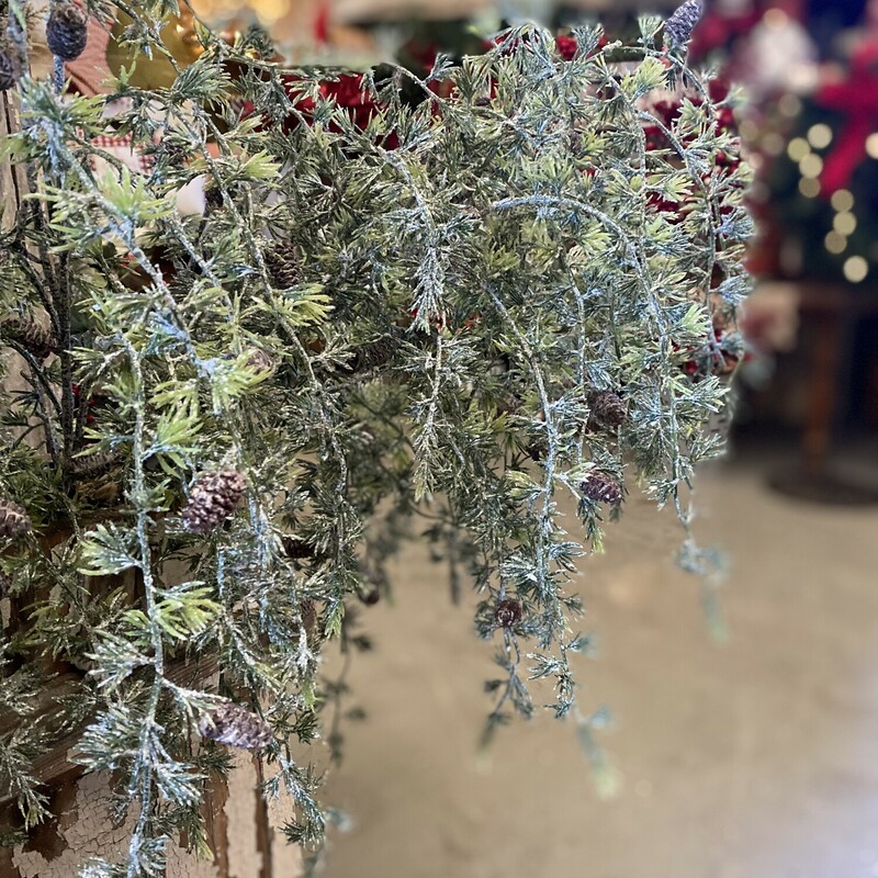 This mini pine spray has small pine cones and a touch of sparkle and drapes beautifully.  This stem would be perfect on a mantle, cabinet or in an arrangement.