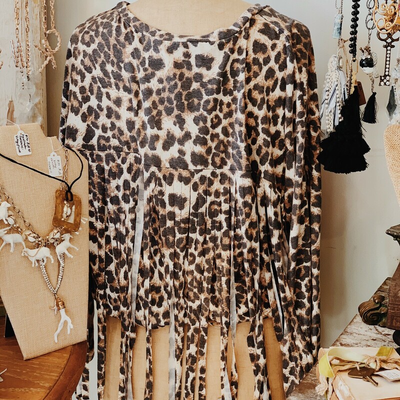 This adorable leopard print shirt is a soft stretchy material with fring on the back!