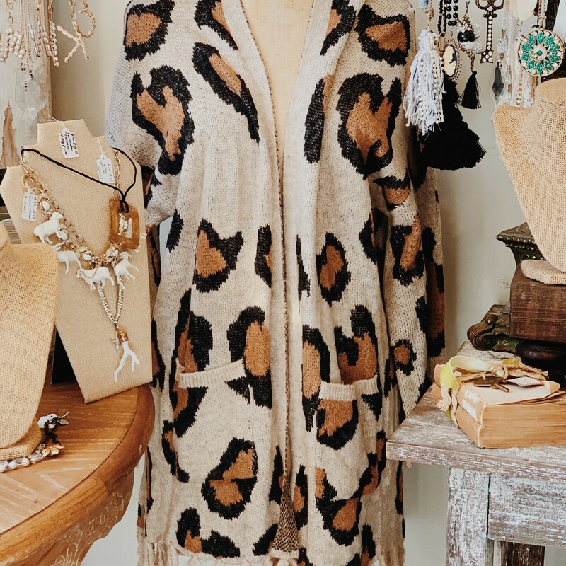 The perfect warm and cozy cardigan for fall and winter! Adorable oatmeal color with animal print!