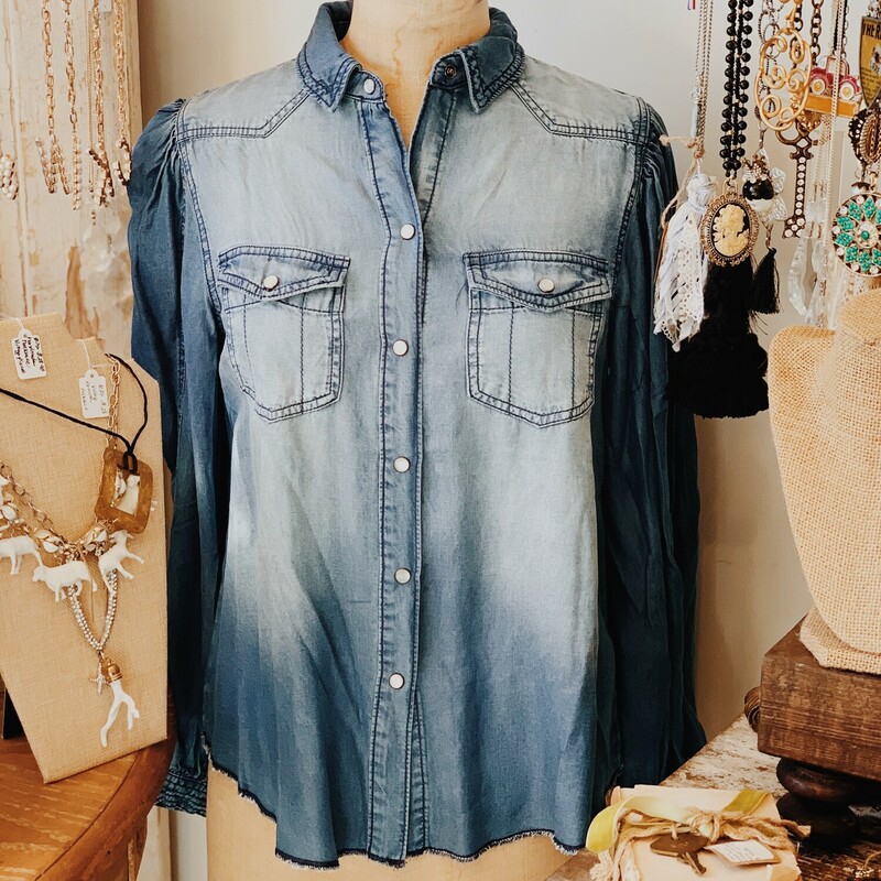 This adorable denim blouse has a frayed edge around the bottom and peasant style sleeves! Perfect to pair with black jeans and boots!