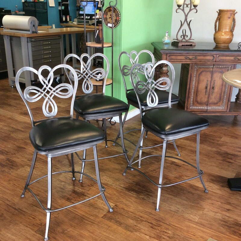 This is a very nice set of barstools. They feature a metal  frame and a swiveling leather upholstered seat.