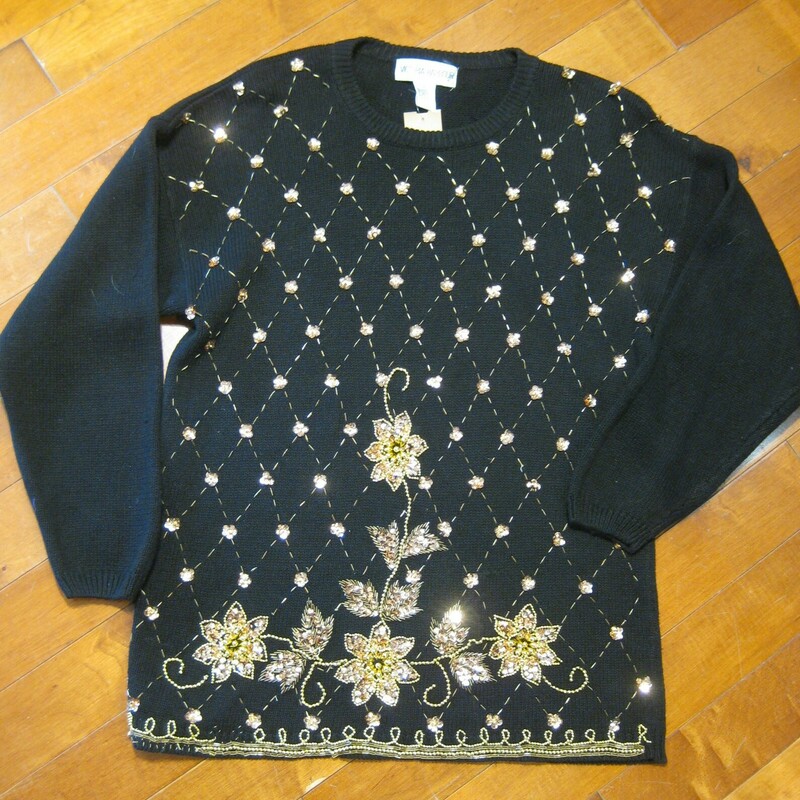 Gorgeous vintage sweater in Black with very sparkly gold sequin floral embroidery<br />
55% Ramie and 45% cotton<br />
Marked size Medium but will fit a size large as well<br />
Flat Measurements<br />
Armpit to Armpit: 22<br />
Underarm sleeve seam length: 19.25<br />
Length from back neck to hem: 28<br />
<br />
Excellent condition with a few beads missing near the hem as shown<br />
thanks for looking!<br />
<br />
#43984