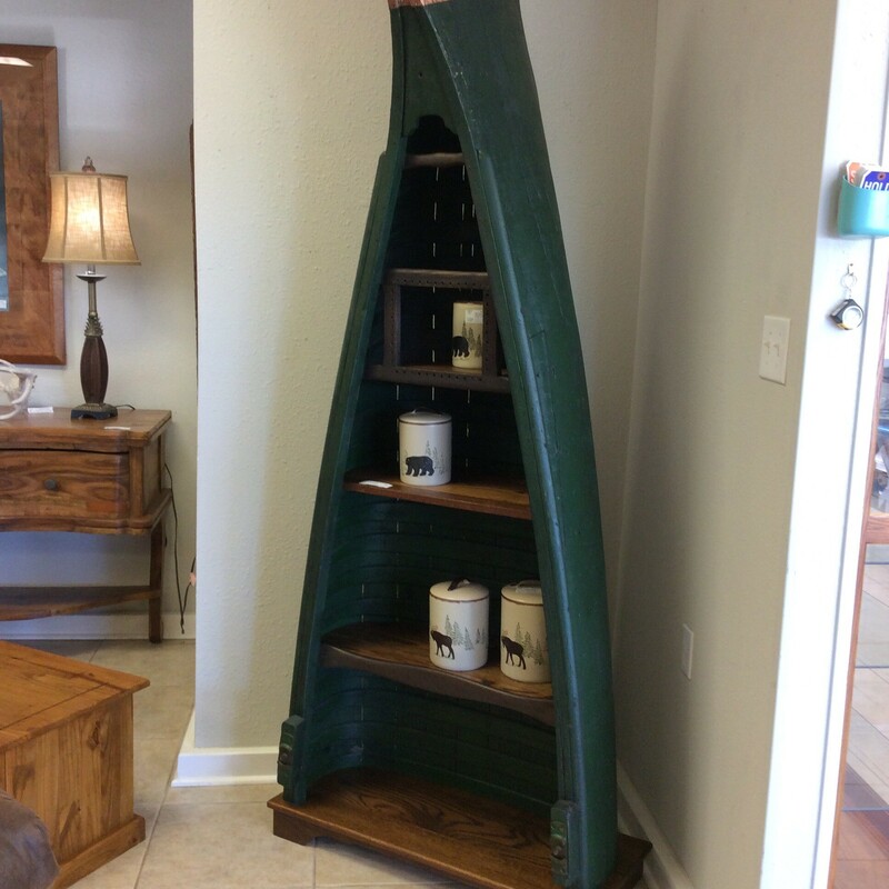 This is a REAL canoe made into a bookcase!
It is a hunter green and has a copper end. It also has four shelves for all your books or nick nacks.
A very unusual unique piece.....
Measures 95x32x15