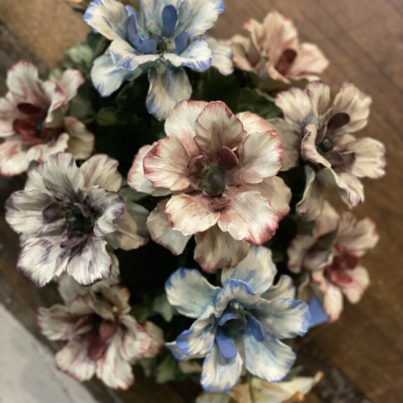 Capidomonte Flowers<br />
Porcelain Italian pottery flowers. VERY delicate<br />
Mint condition, no chips or breaks!<br />
White, blue, pink, purple, green, yellow<br />
Size: 19 long x 12 high