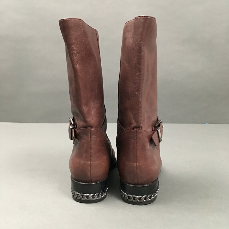 Nine West , Ceshirly leather, Brown with ankle strap, Carolinna Espinosa, made in China  Size: 7 fabric lining
10\" inch boot from shaft to mid calf,
1.25 \" inch heel with embedded gun metal chain detail.
Very soft brown leather, very gentle wear, great condition.