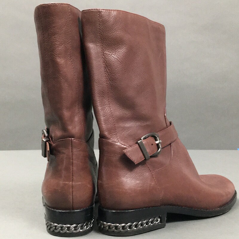 Nine West , Ceshirly leather, Brown with ankle strap, Carolinna Espinosa, made in China  Size: 7 fabric lining<br />
10\" inch boot from shaft to mid calf,<br />
1.25 \" inch heel with embedded gun metal chain detail.<br />
Very soft brown leather, very gentle wear, great condition.