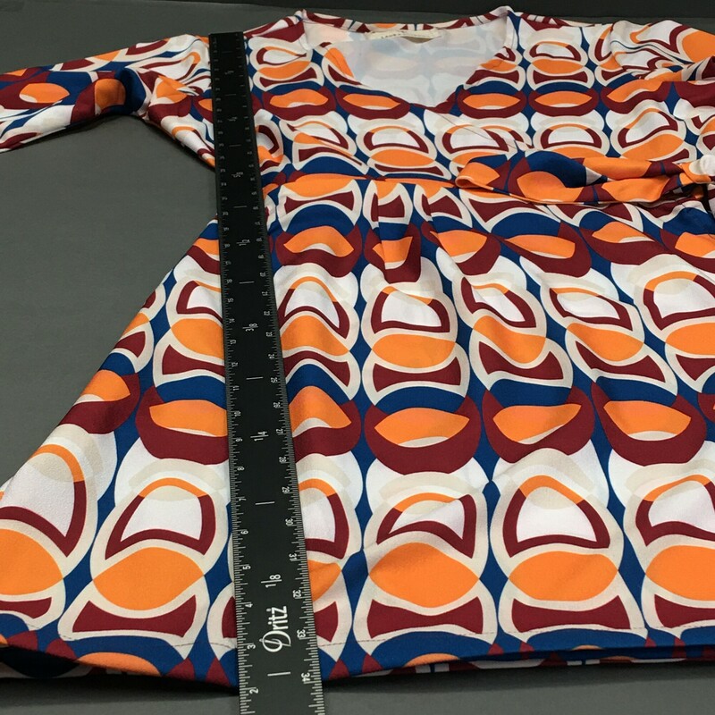 Laura Estrada, Pattern, Size:S/ M. Laura Estrada, Pattern, Size: M 3/4 sleeve,55% polyester / 45% rayon geometric print  tangerine, brick red, yale blue, and white. This is a light pull over, cute V neck wrap and tie at the side of the waist, unlined dress. This dress falls just over the knees, and is a probable fit for size 6 to 8. Please see the measurements. There are no material tags. Columbian designer Laura Estrada is exclusive to L'Unique Boutique in CT. This dress is one of a kind!<br />
8.4 oz