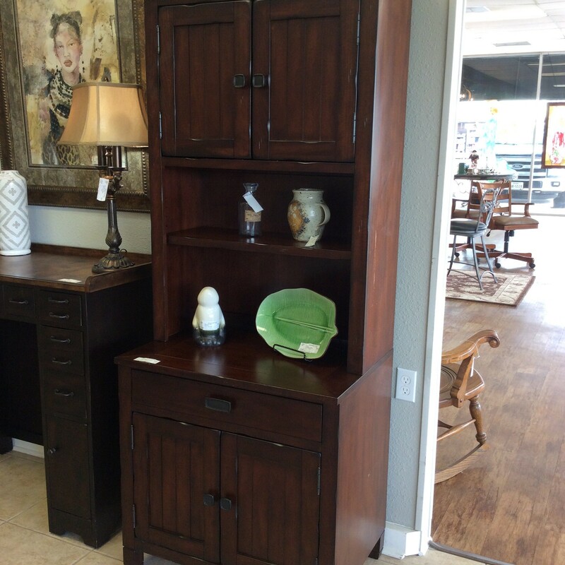 This is a beautiful secretary/bookcase by Legends. Rustic in style, it features a rich, dark wood finish with distressing for that aged, weathered look. It includes adjustable shelving, a pull-out monitor tray and cabinet doors. Best of all,  we have 2 of them priced separately.