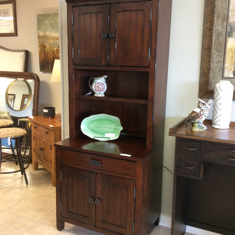 This is a beautiful secretary/bookcase by Legends. Rustic in style, it features a dark wood finish with distressing for that aged, weathered look. It includes adjustable shelving, a pull-out keyboard tray and cabinet doors. Best of all, we have 2 of them priced separately.
