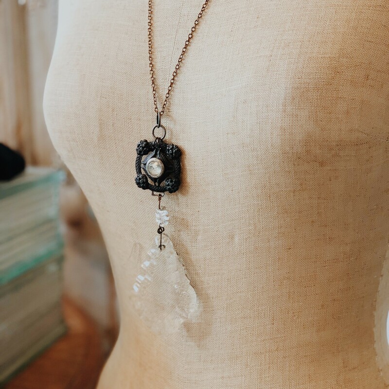 This beautiful necklace was handmade by on of our jewelry artists! The lovely, repurposed crystal makes this gem one of a kind! It is on a 27 inch chain.