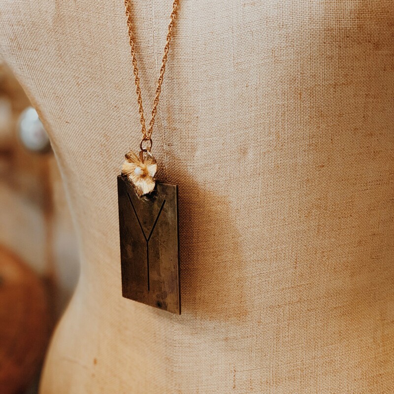 This lovely, handmade necklace is truly one of a kind! It was elegantly crafted and has a Y initialed brass plate. It is on a 32 inch chain.