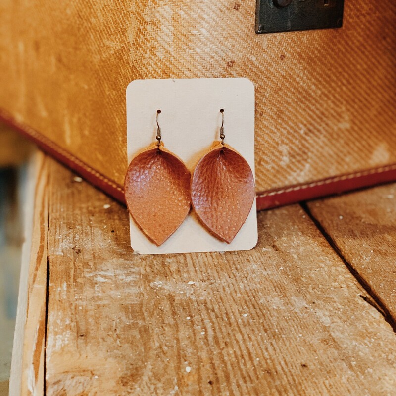 These genuine leather earrings from The Olive Branch were carefully designed and hand crafted. They measure 3 inches long.