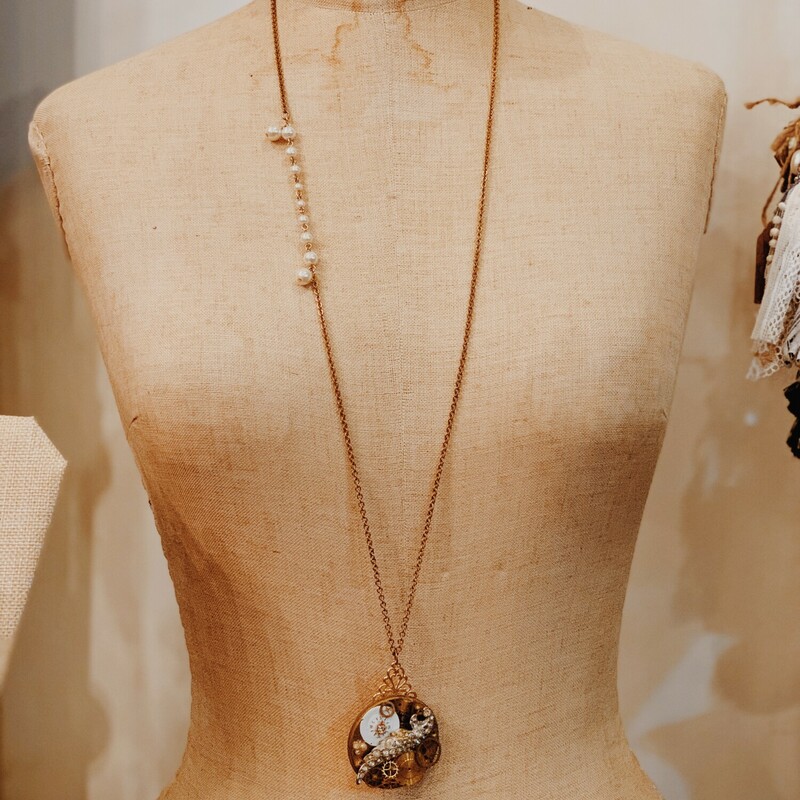 This one of a kind, handmade necklace is perfect for layering to give your jewelry flare! It is on a 36 inch chain.