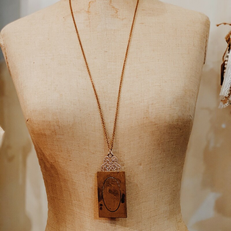 This lovely necklace was handcrafted by one of our artists! It has an O initialled brass plate. It is on a 32 inch chain.