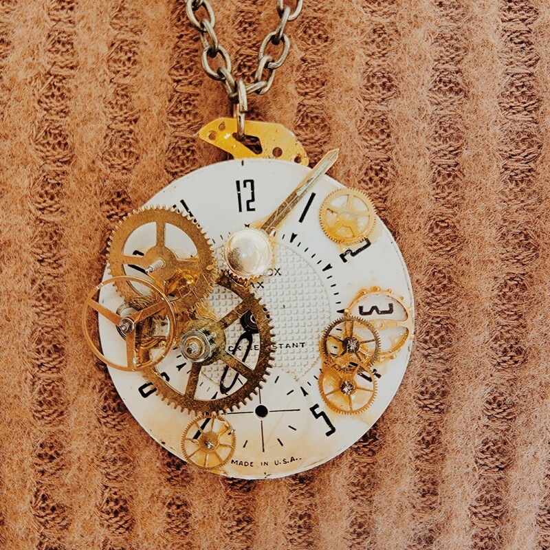- Hand crafted necklace
- 26 Inch chain
- Clock face pendant