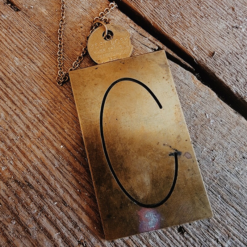 - Hand crafted necklaces
- 33 inch chain
- C engraved brass plate
- Antique key used as connector