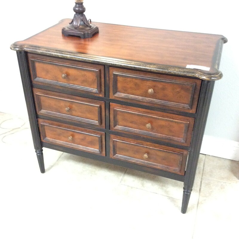 Very cute two tone desk of browns and rust colors. This piece has six drawers and column like legs.
Measures 36x20x30