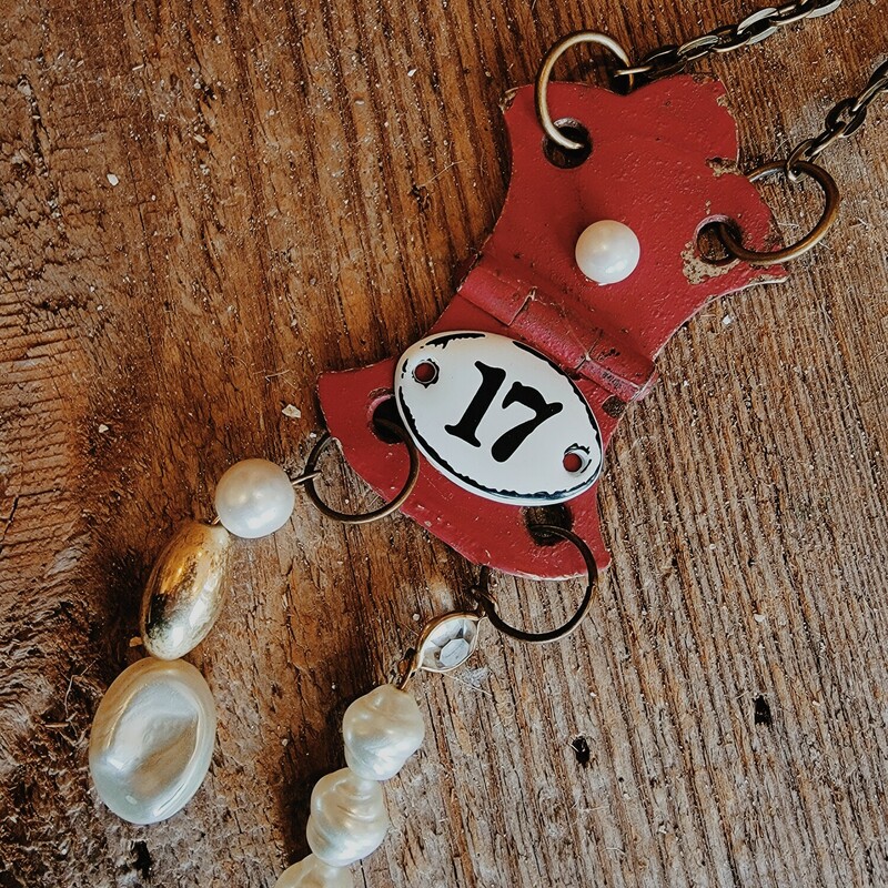 This adorable necklace was hand crafted! The artist used a vintage red hinge as the pendant and attached the number 17 with two strands of beads hanging below.<br />
Chain: 30 Inches