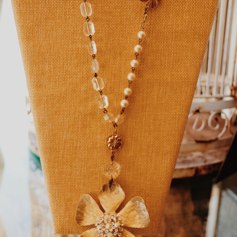 This necklace from Kelli Hawk Designs was handmade from vintage pieces! The beautiful flower pendant measures 4 inches long, and the necklace is on a 19 inch chain.