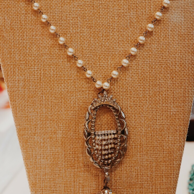 This lovely Kelli Hawk Designs necklace is on a 21 inch chain that transitions from chain to pearl chain. The pendant is made from beautiful vintage pieces including a silver buckle.