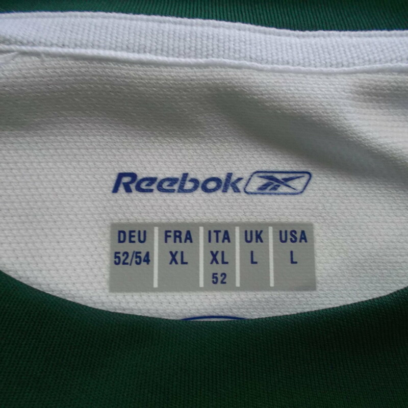 Reebok Men's Short Sleeve Shirt Size Large White Polyester #9286 \"NEW\"<br />
Rating:   (see below) 3 - Good Condition<br />
Team: N/A <br />
Event: n/a  <br />
Brand: Reebok<br />
Size: Large - Men's (Measured Flat: Across Chest 23\"; Length 30\") armpit to armpit & shoulder to bottom hem<br />
Color: White<br />
Style: Short sleeve screen pressed shirt<br />
Material: 100 Polyester <br />
Condition: - Good Condition (GUC)- wrinkled; Original tag; Material looks and feel great; Light stain on the back; Few light snags; No rips or holes(Please use photos to see the condition details) <br />
Shipping cost: $3.37<br />
Item #: 9286