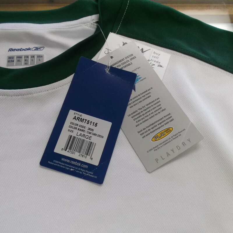 Reebok Men's Short Sleeve Shirt Size Large White Polyester #9286 \"NEW\"<br />
Rating:   (see below) 3 - Good Condition<br />
Team: N/A <br />
Event: n/a  <br />
Brand: Reebok<br />
Size: Large - Men's (Measured Flat: Across Chest 23\"; Length 30\") armpit to armpit & shoulder to bottom hem<br />
Color: White<br />
Style: Short sleeve screen pressed shirt<br />
Material: 100 Polyester <br />
Condition: - Good Condition (GUC)- wrinkled; Original tag; Material looks and feel great; Light stain on the back; Few light snags; No rips or holes(Please use photos to see the condition details) <br />
Shipping cost: $3.37<br />
Item #: 9286