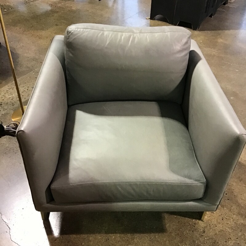 This super chic gray leather chair from RH is still featured on their website today! The chair is from the Milo Baughman collection and is model #3426 (current retail for RH Members is $5400!). Crafted by American designer Milo Baughman in 1968, this visually arresting chair features an upholstered cube that seems to float inside an angular flat-bar frame. Thick, loose cushions offer ultra-comfortable seating. Made by hand today as it was more than four decades ago by Thayer Coggin, master furniture crafters in North Carolina.
Dimensions are 31 in x 31 in x 29 in