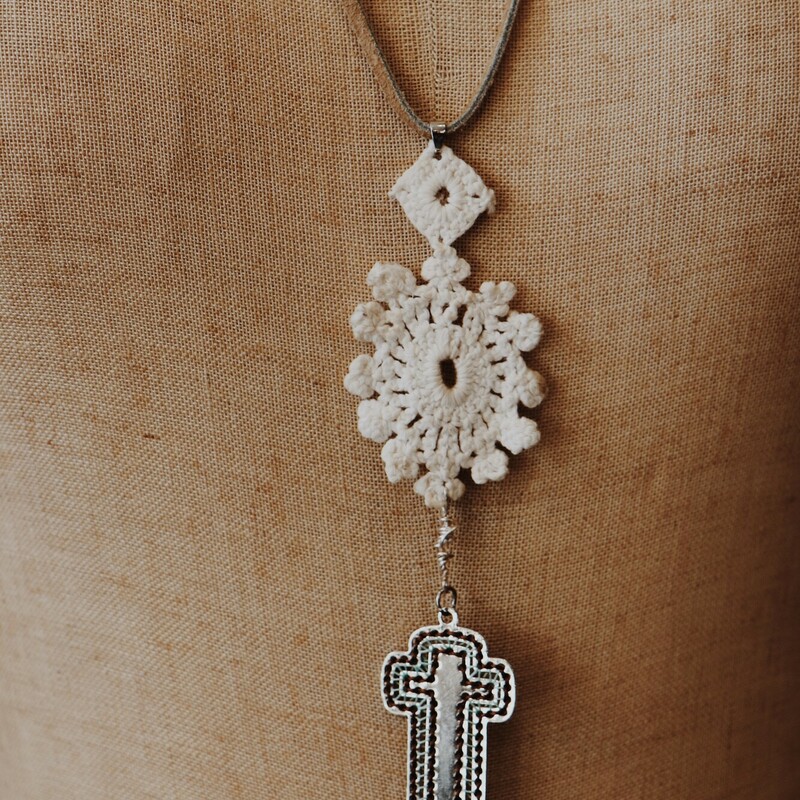 This Kelli Kawk Designs necklace is on a 28 inch leather cord and has a crochet piece with a cross hanging from it!