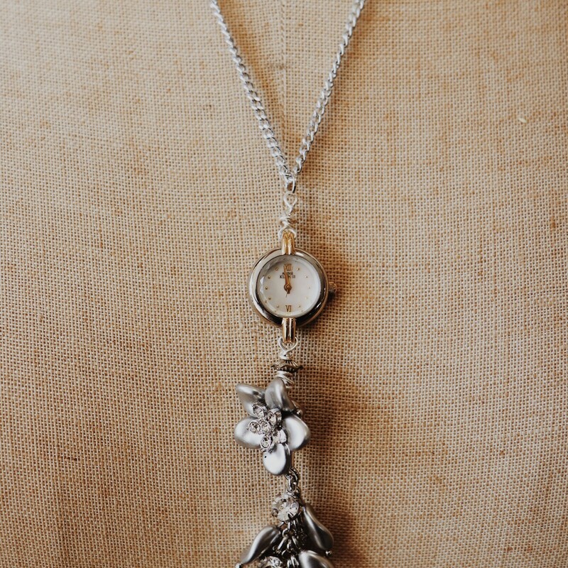 This vintage watch necklace is by Kelli Hawk Designs! The pendant is 4 inches long, and it is on a 22 inch chain.