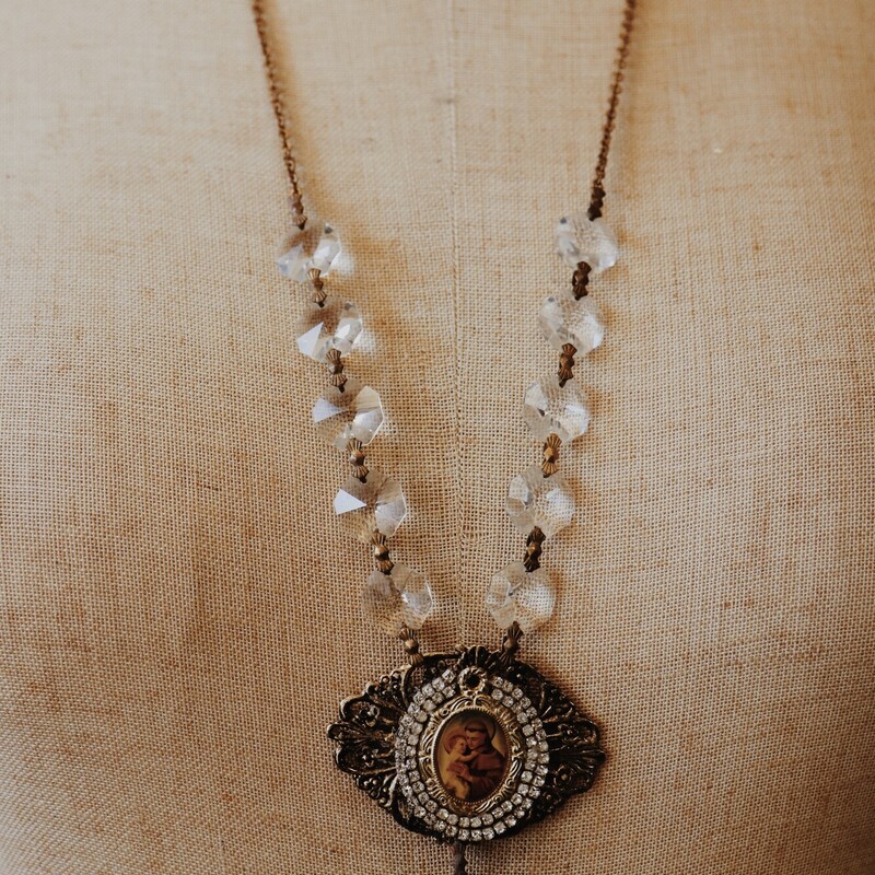 This Kelli Hawk Designs necklace is on a 28 inch chain and is made of vintage pieces!