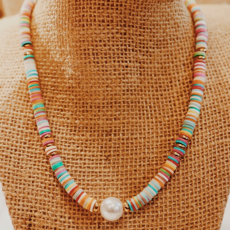 This fun necklace with a pearl center is on a 16 inch strand with a 2 inch extender!