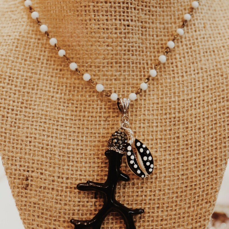 This Kelli Hawk Designs necklac in on a beaded 19 inch chain with a black antler pendant and a black shell charm!