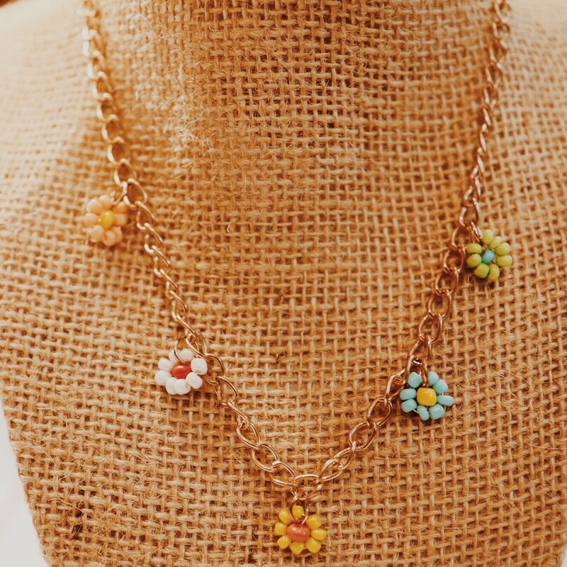 These adorable Kelli Hawk Designs dainty flower necklacees are on a 19 inch chain! Flower colors vary slightly.